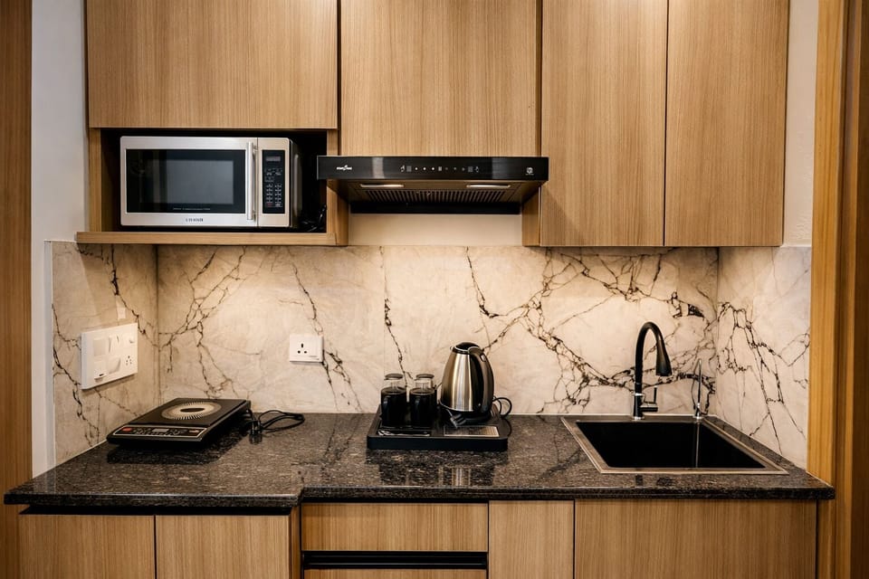 Mini-fridge, microwave, dishwasher, cookware/dishes/utensils