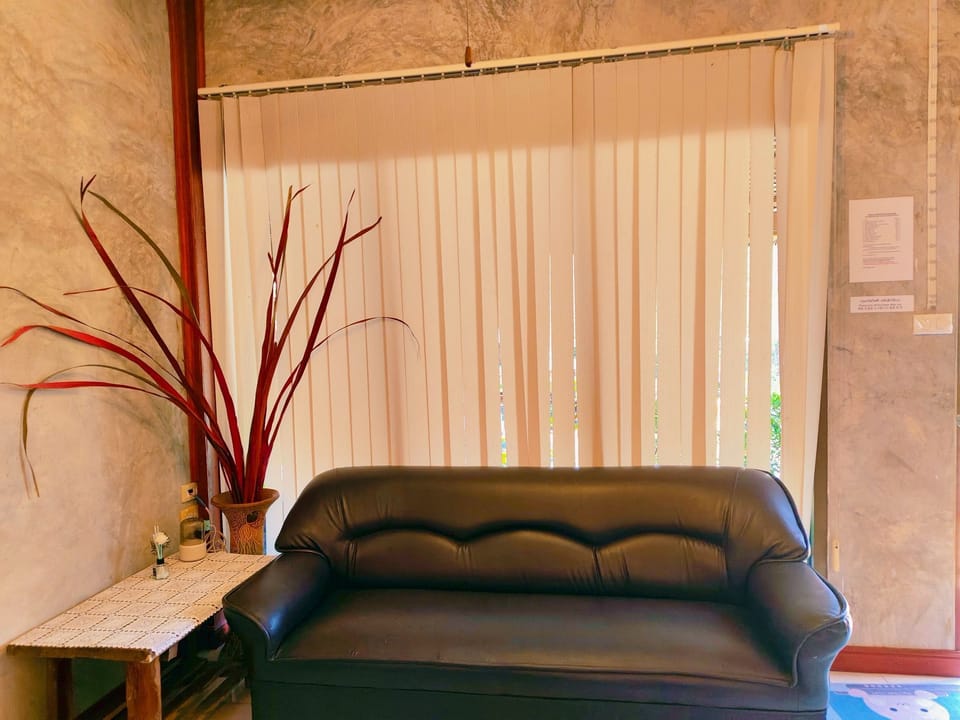 Triple Room, Garden View | Living area | 32-inch flat-screen TV with digital channels