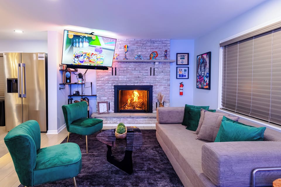 Cozy fireplace lounge — movie nights and game time together.