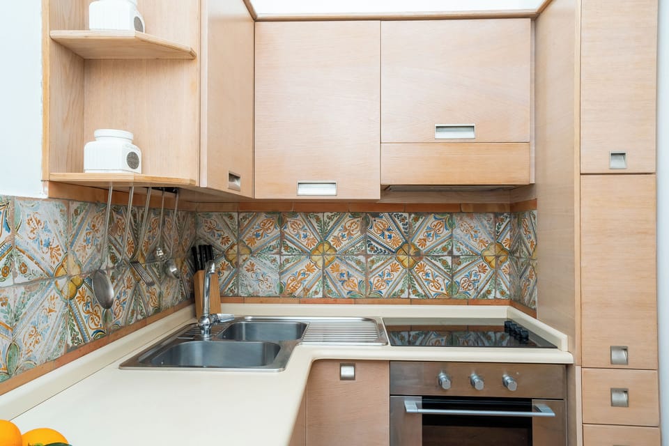 Apartment, Sea View | Private kitchen | Full-size fridge, microwave, oven, stovetop
