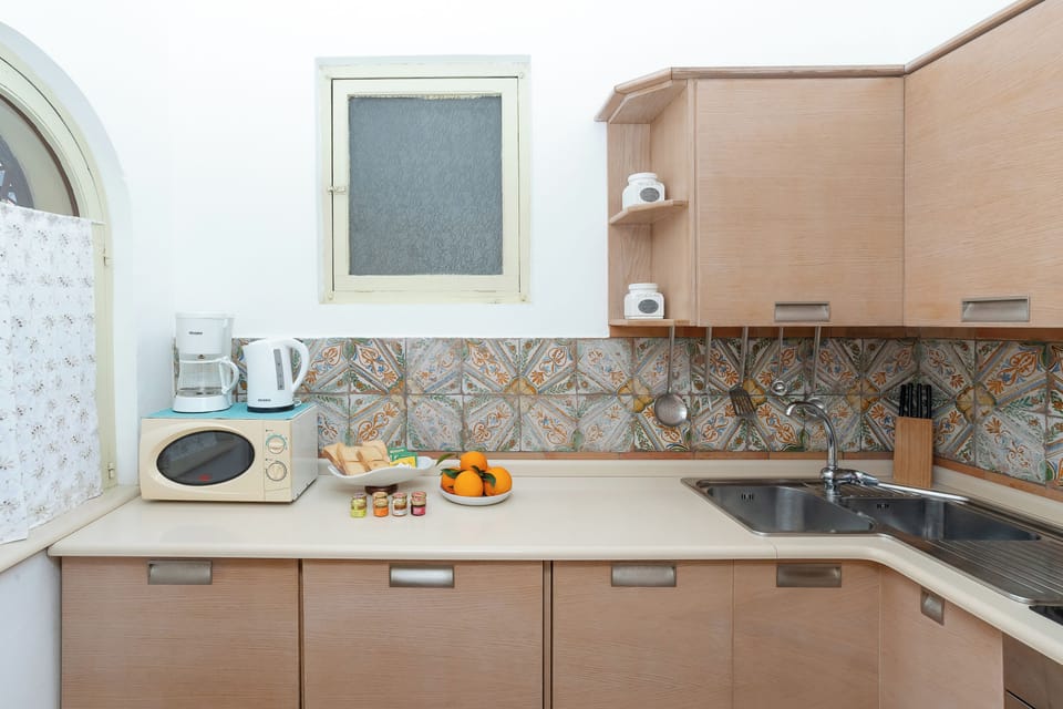 Apartment, Sea View | Private kitchen | Full-size fridge, microwave, oven, stovetop