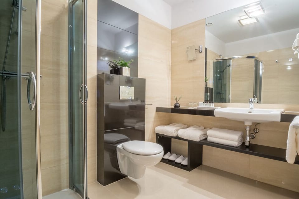Refresh in a spotless glass shower and plush towels.