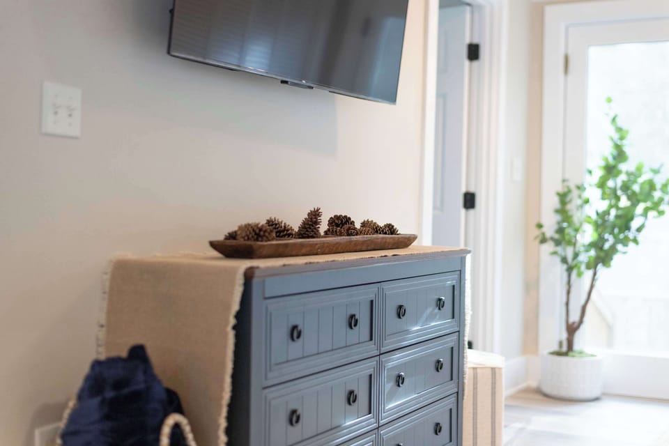 Open concept living room with a brand new sleeper sofa and Smart TV