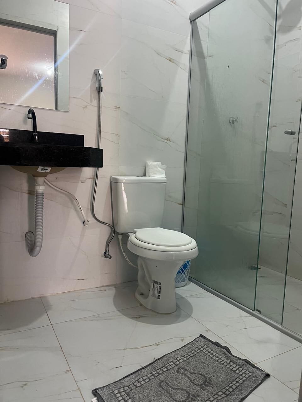 Shower, towels, soap, toilet paper