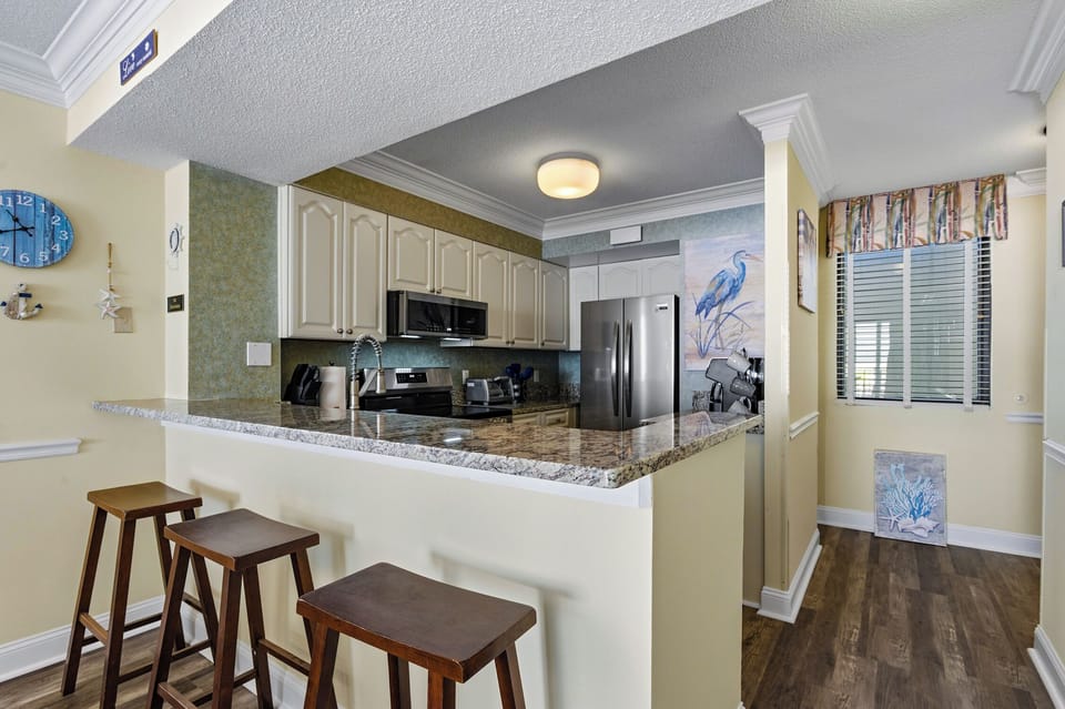 Kitchen has a fun eat-in bar