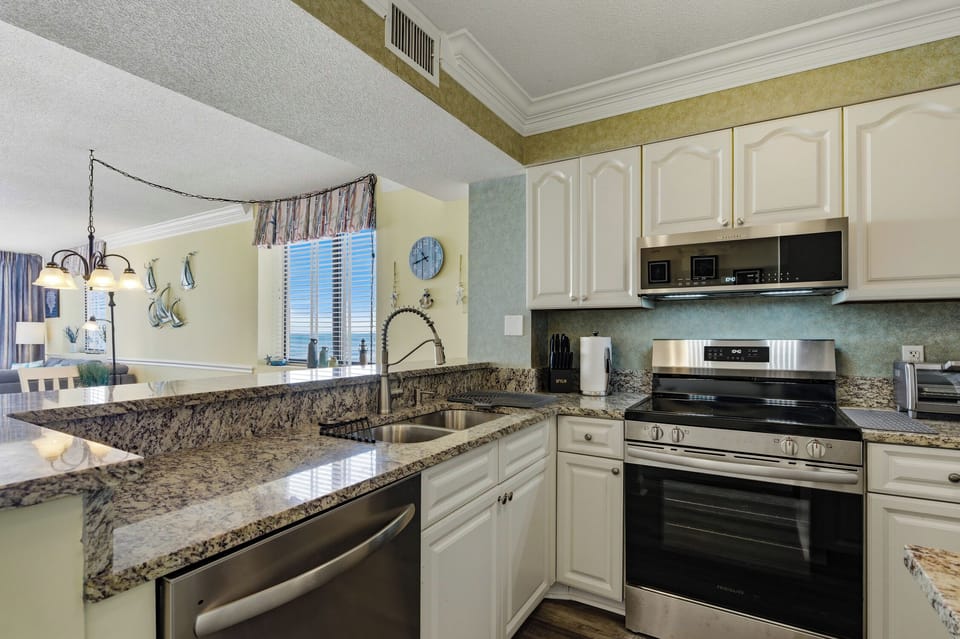 Kitchen has stainless steel appliances