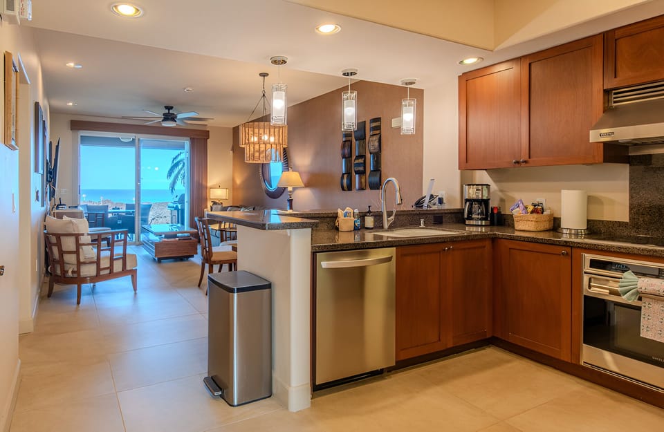 Cook together in a full kitchen with spacious breakfast bar.