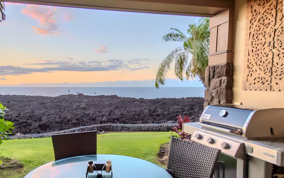 Sip sunset cocktails beside the grill with endless ocean views.
