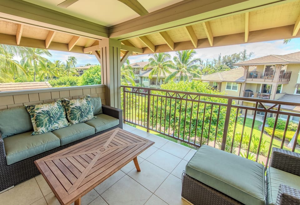 Lounge on the breezy lanai with lush palm views.