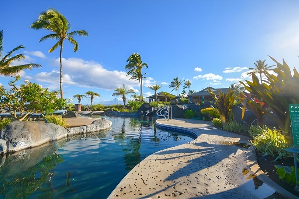 Unwind by the curving lagoon pool under warm island sun.