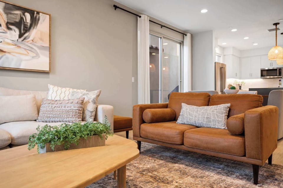 Spacious living room with modern furnishings and plenty of natural light