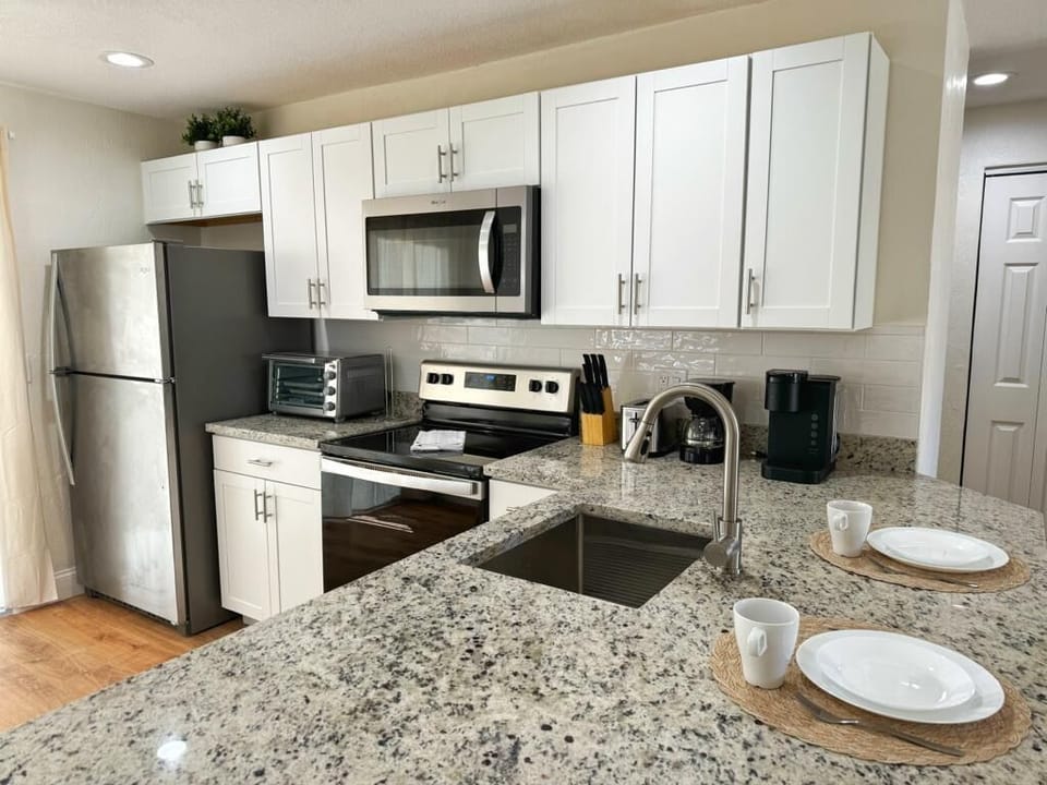 Kitchen with all utensils! Pots, pans and etc!
