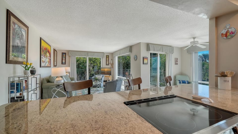 Spacious living room with cozy seating and garden views