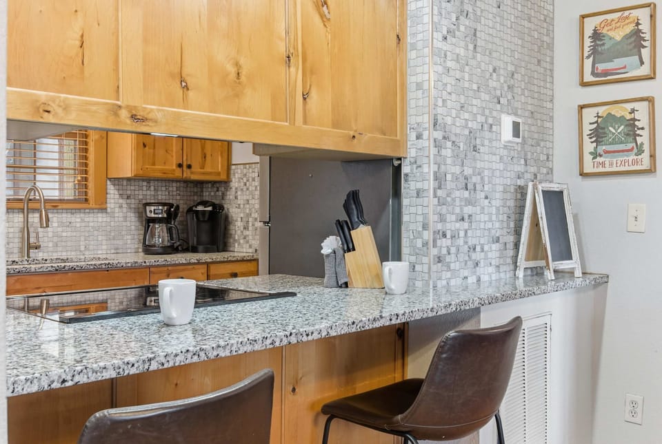 Sip morning coffee or an evening cocktail at the kitchen counter, seating 2​