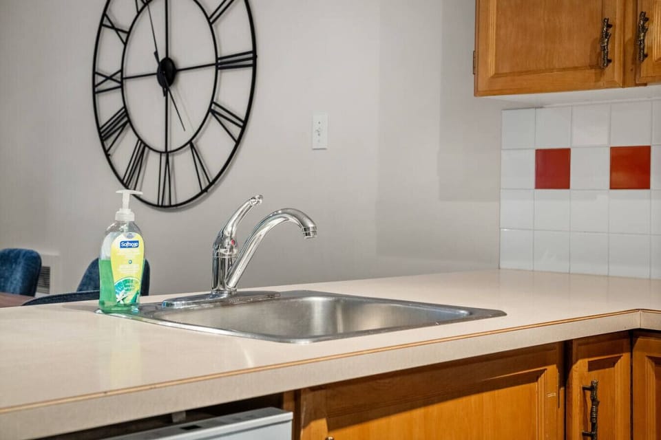 Full kitchen with a drip coffee machine, ground coffee, tea, sugar, and basic condiments (ketchup, mustard, relish.)