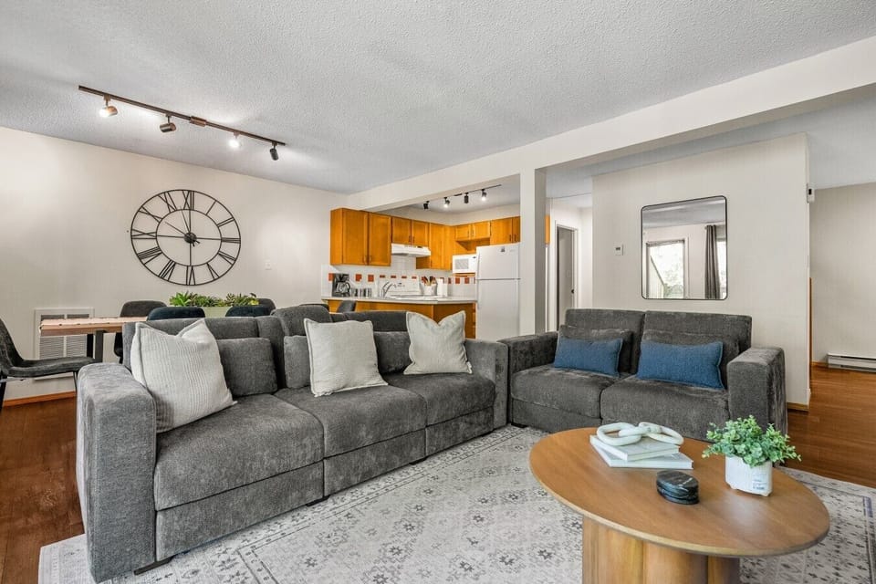 Main floor living room with a Smart TV with cable, board games, cozy seating options, and a decorative fireplace (fireplace can not be used).