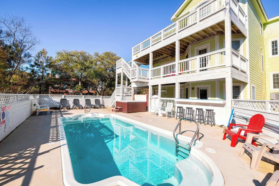 Private Outdoor Pool w/ Sun Deck, Lounge Chairs, Hot Tub, Covered Balcony, and Bar Seating