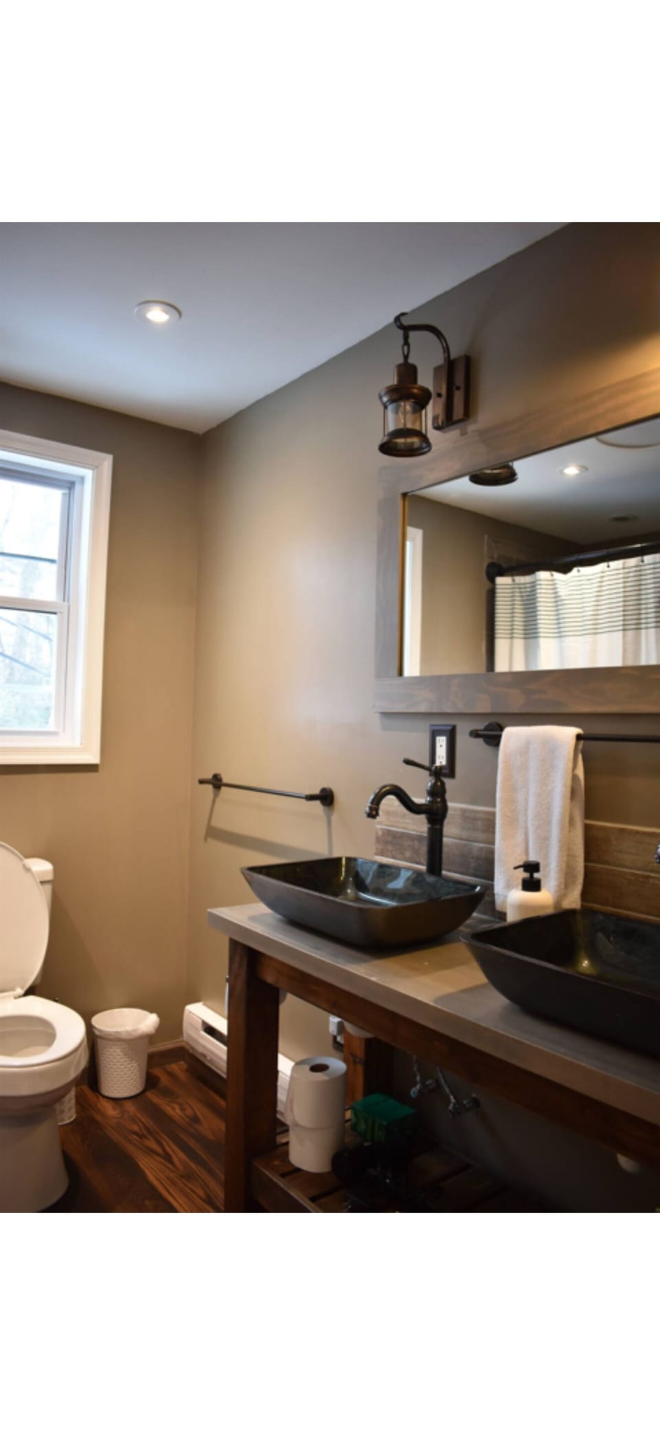 Also large bathtub and toilet along with full-size mirror with plenty of storage