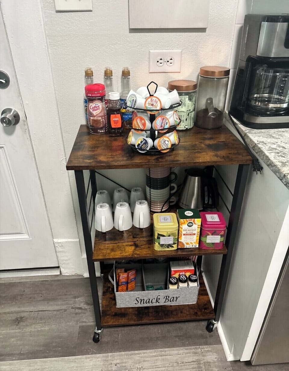 Welcoming coffee & snack station with tea, syrups, K-Cups, and treats