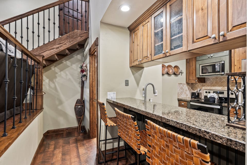 Inviting kitchen counter with bar seating—perfect for casual meals, morning coffee, or gathering while meals are prepared.