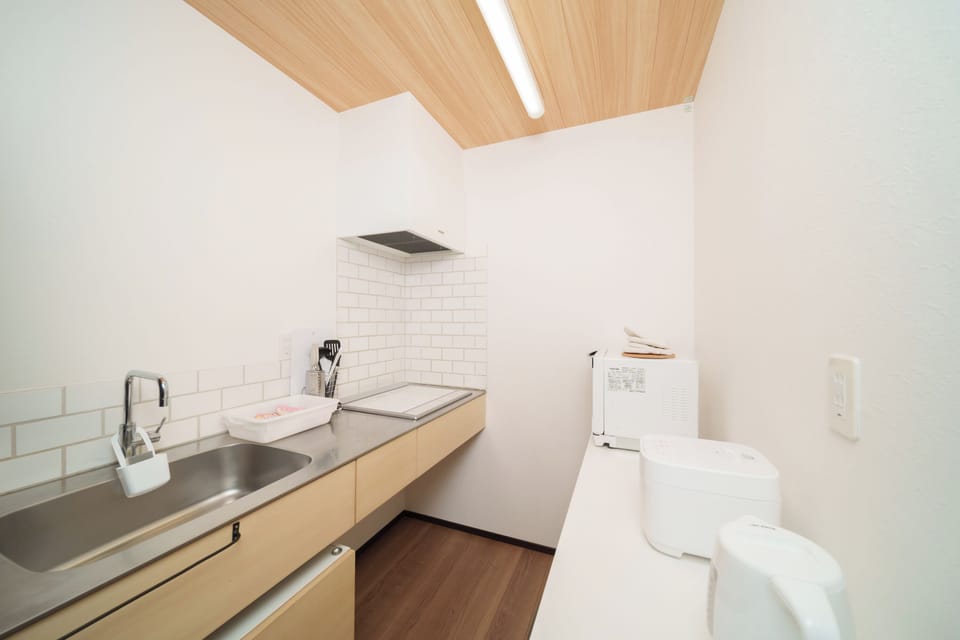 Comfort Condo, Non Smoking | Private kitchen | Full-size fridge, microwave, stovetop, rice cooker