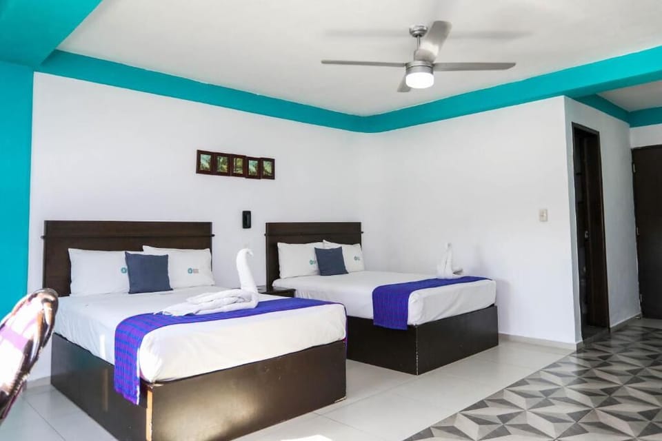 Unwind in airy comfort with crisp linens and ceiling fan.