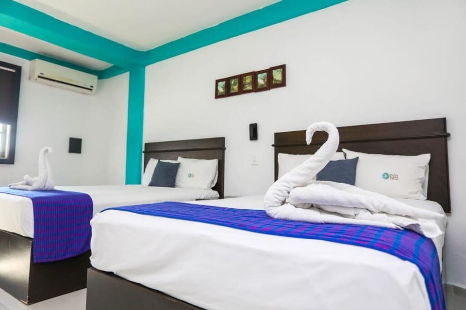 Stretch out on freshly made beds with calm, minimalist vibes.