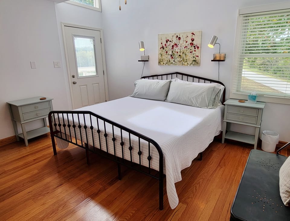 Retire for the night to the primary bedroom with a door onto the deck.