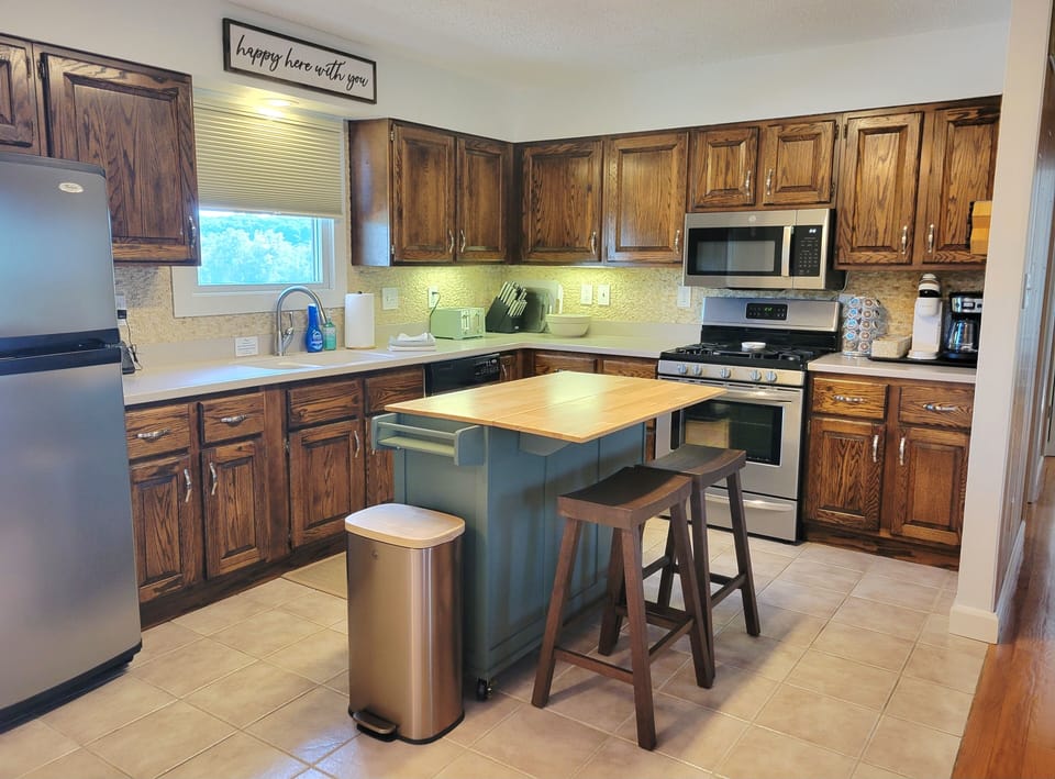 The large kitchen is fully stocked with kitchen essentials.