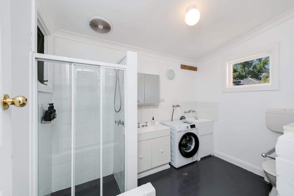Bathroom with Shower and Washing Machine