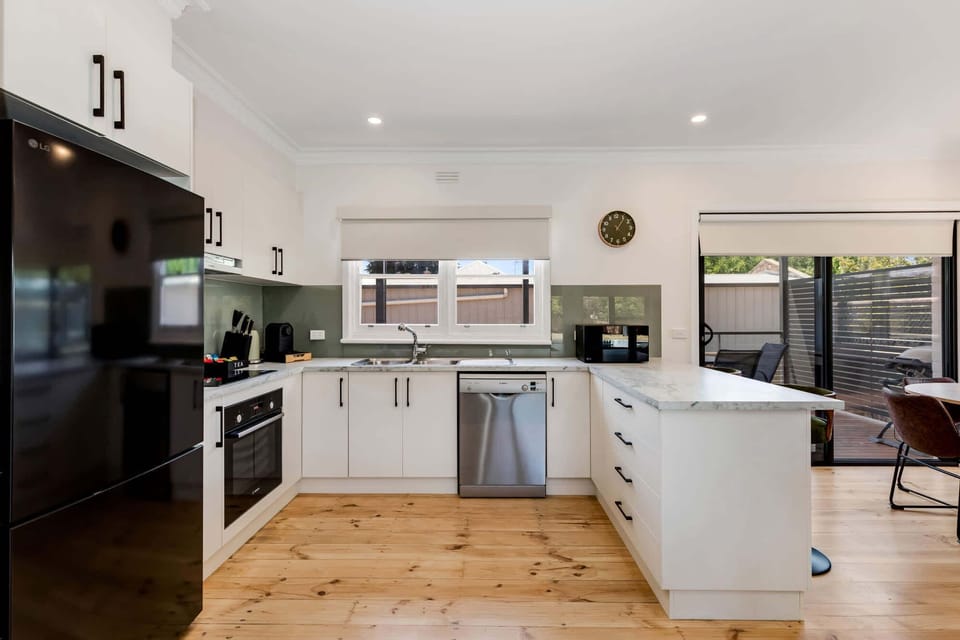 Modern White Bright Kitchen with Sleek Appliances