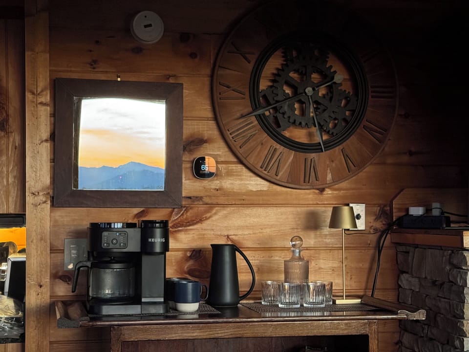 That is a mirror hanging above the coffee machine! 