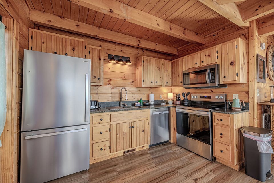 Open kitchen with brand new stainless steel appliances. Knives are sharp!