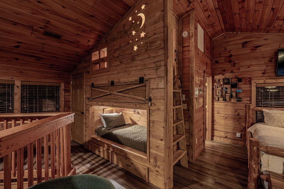 Custom-built Starry Night twin bunkbeds in loft, each bunk with light & plugs.