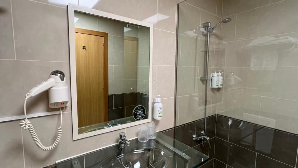 Hair dryer, towels, soap, shampoo