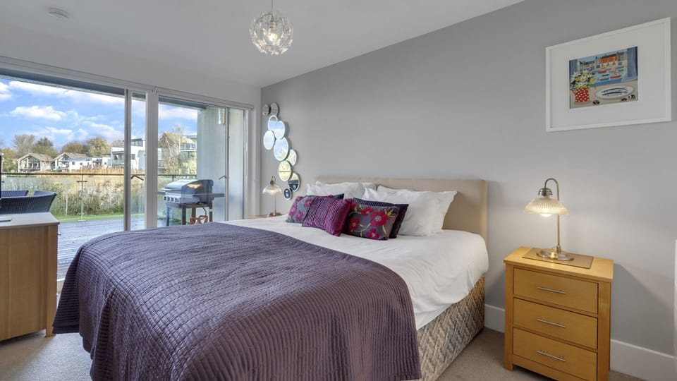 Bedroom two has a king-size bed and sliding doors that open to the terrace.