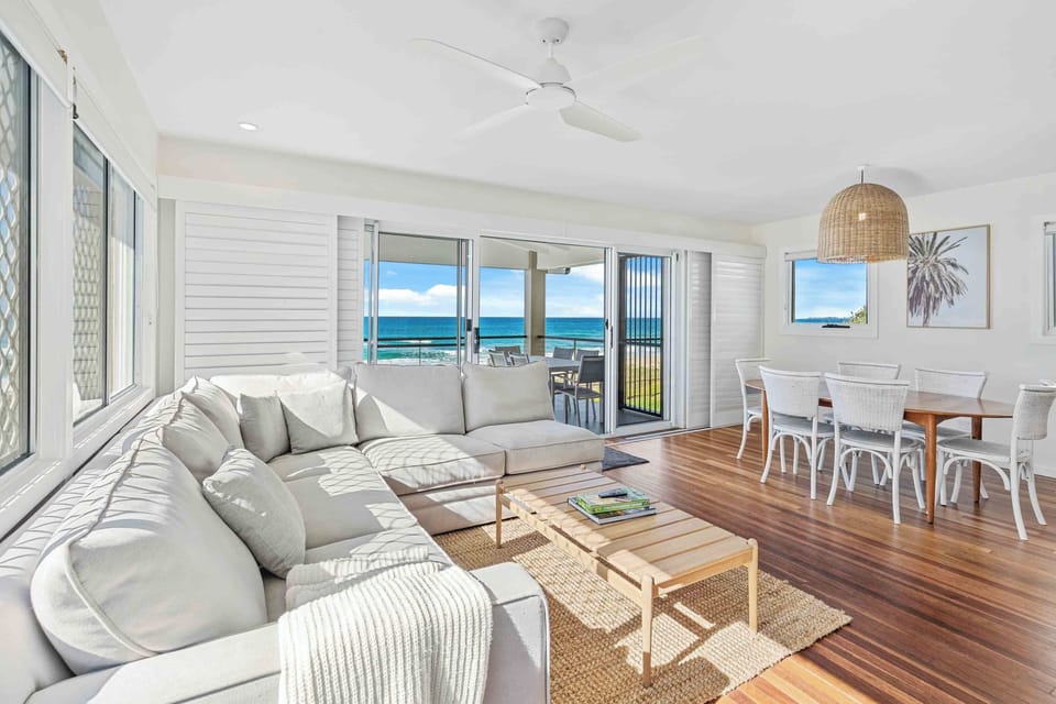 Apartment, Beach View | Living area | Flat-screen TV