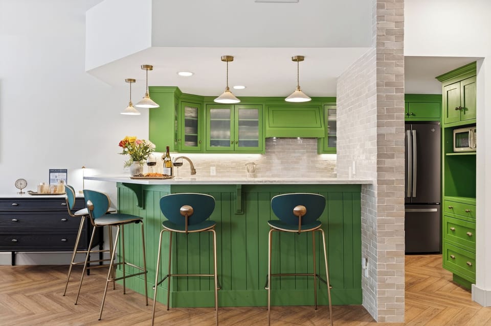 Bright, fully equipped kitchen with a spacious island and bar seating—perfect for cooking, gathering, and après-ski snacks.