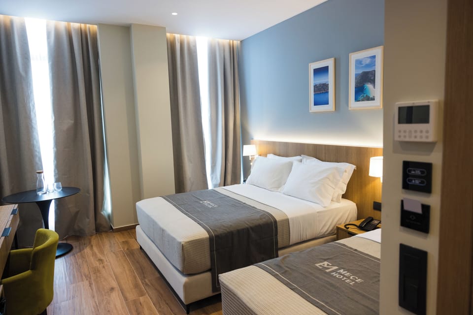 Standard Triple Room | Minibar, in-room safe, desk, blackout drapes
