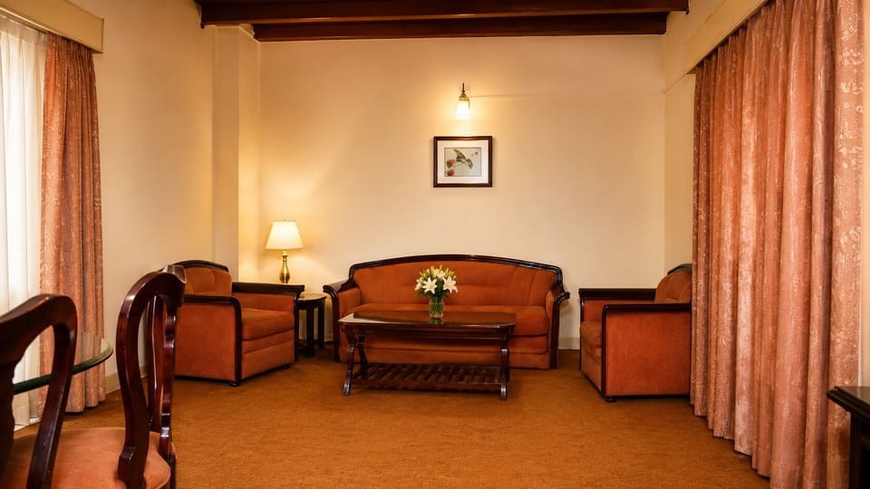 The Grand Suite | Living area | 10-inch TV with cable channels, first-run movies