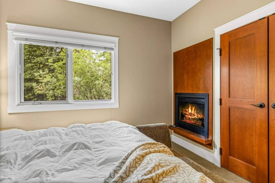 Cozy bedroom with a fireplace.