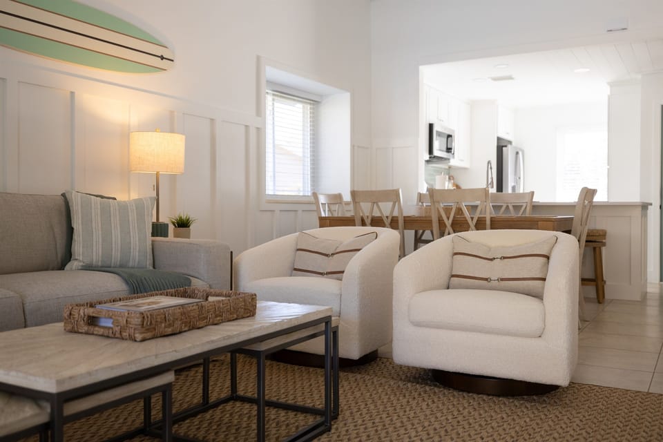 Relax in elevated coastal comfort 🌊
Plush seating, warm textures, and an open layout designed for gathering after sun-filled days
