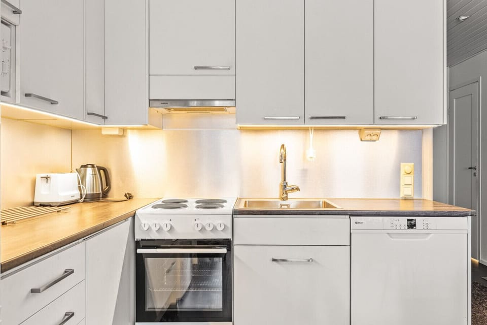 Sleek and functional; including a dishwasher, oven, and premium coffee facilities.