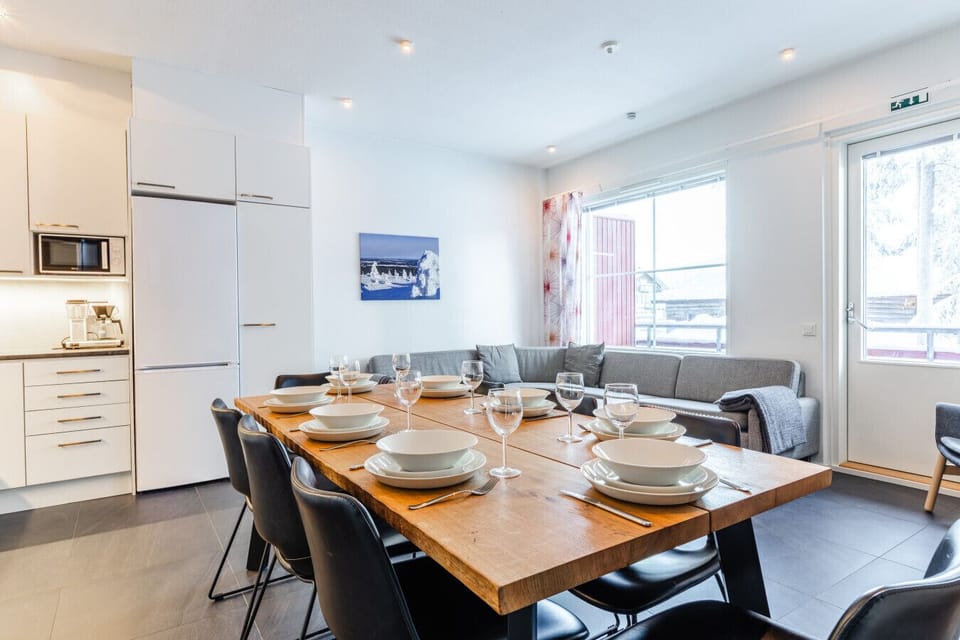Fully equipped modern kitchen connected to a large dining area—ideal for hosting family dinners.