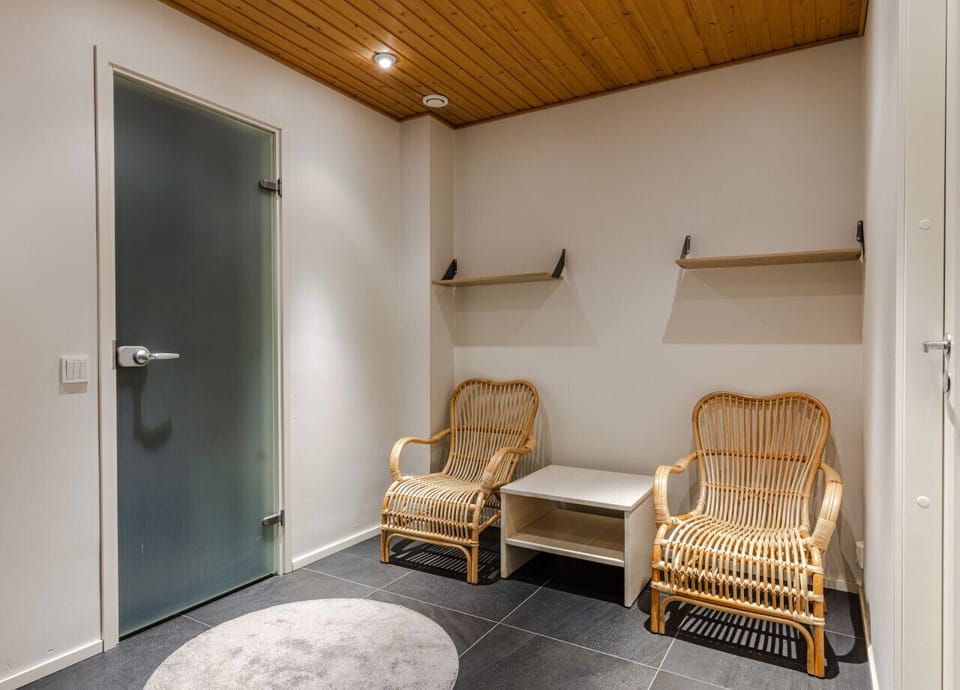 Convenient seating area near the sauna—perfect for cooling down or getting ready.