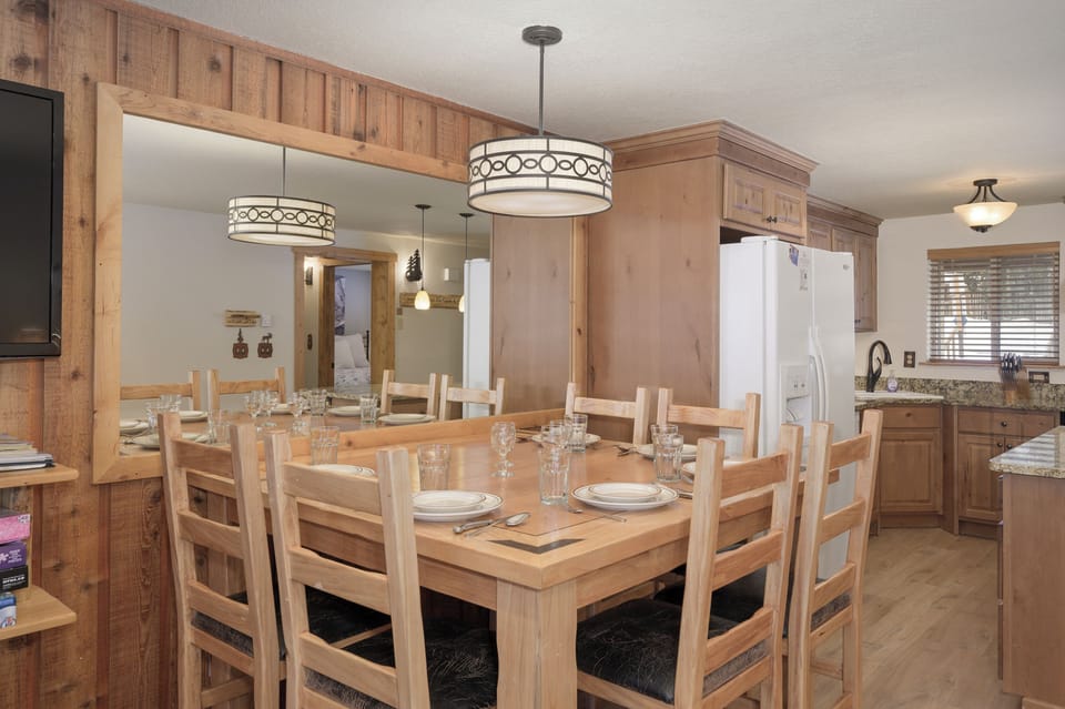 Your dining room brings everyone together with warm wood finishes and thoughtful lighting for memorable meals.