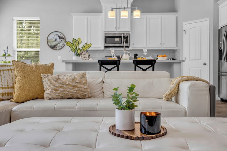 Main living room – comfortable seating beside the kitchen and dining area.