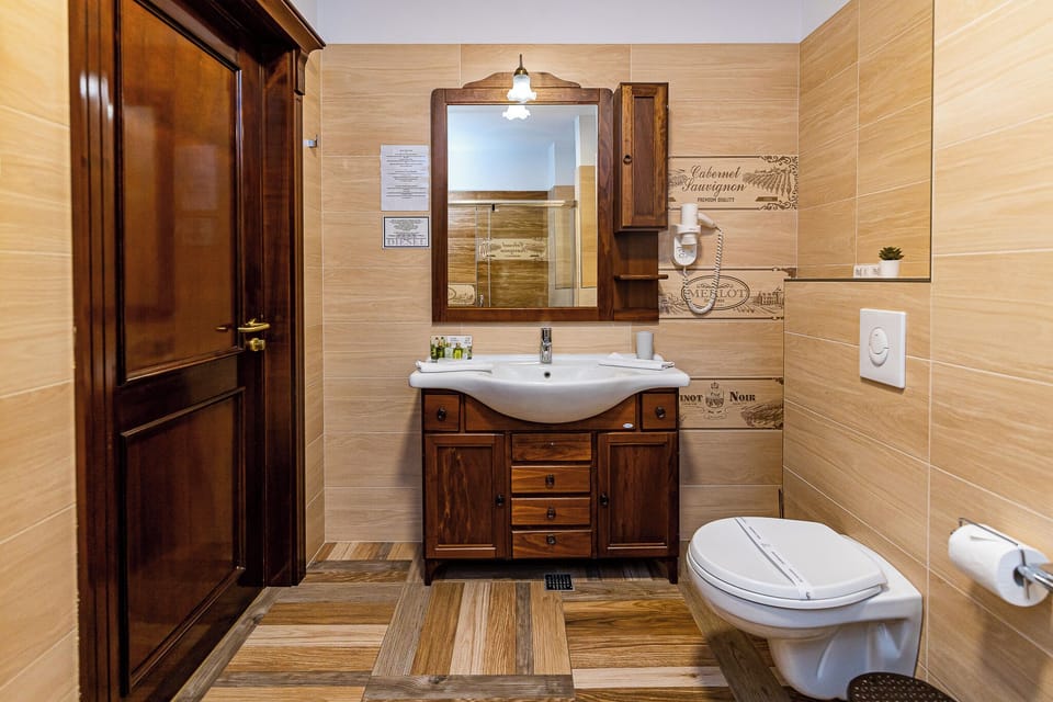 Suite, Balcony, Lake View | Bathroom | Slippers, towels, soap, shampoo