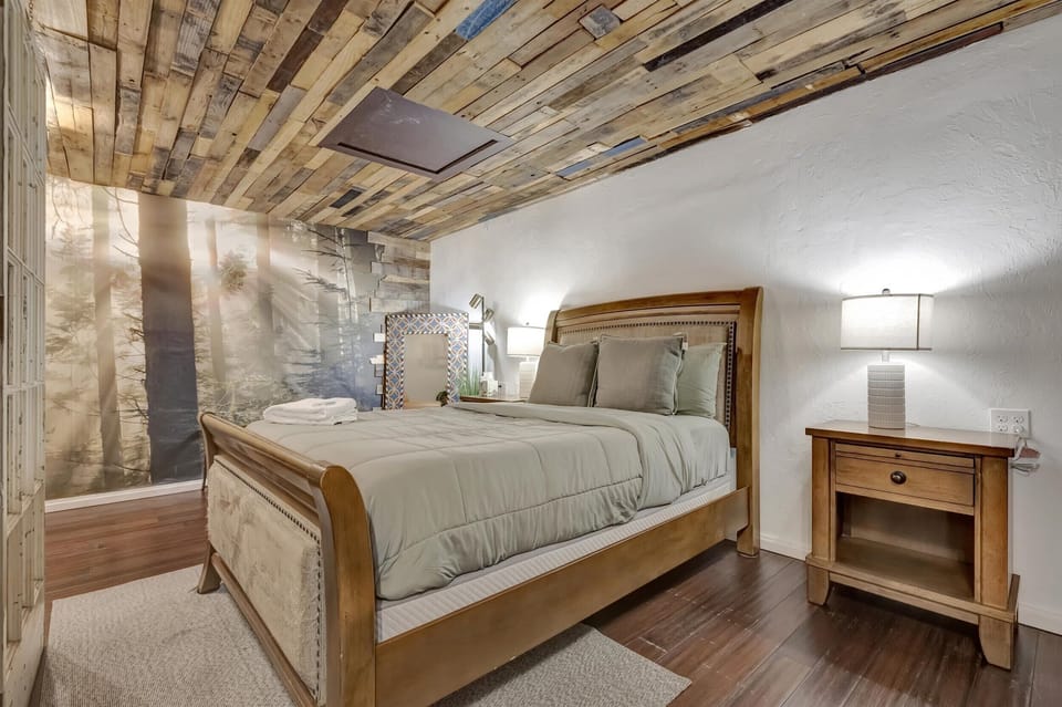 Bedroom setup with rustic finishes and a queen sized bed