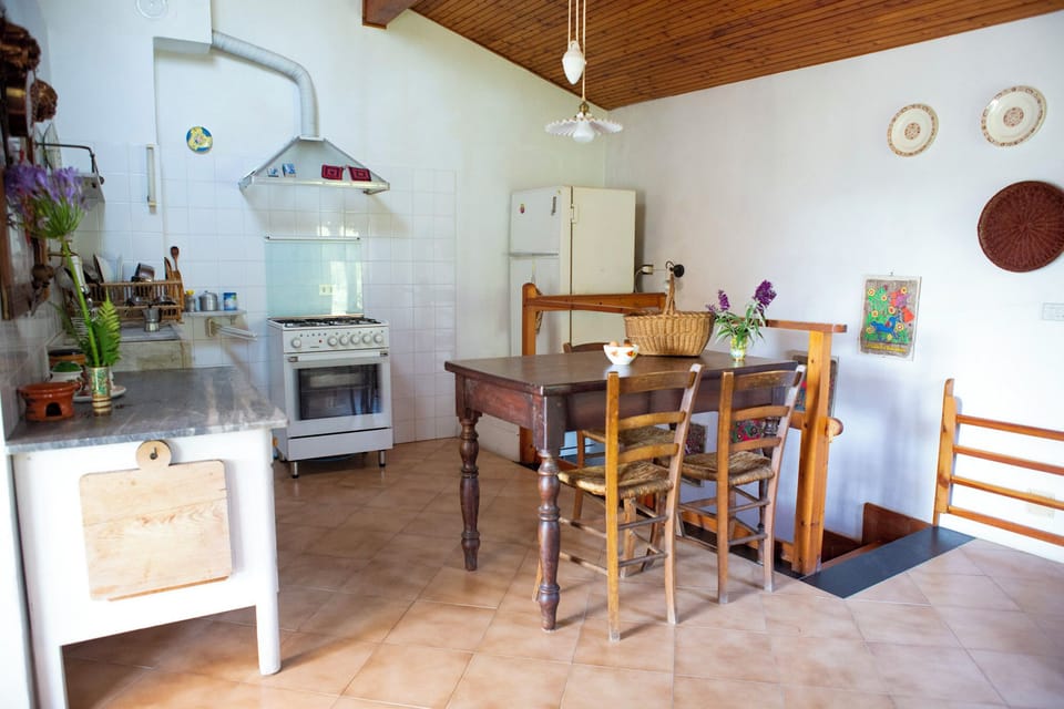 Full-size fridge, oven, stovetop, cookware/dishes/utensils